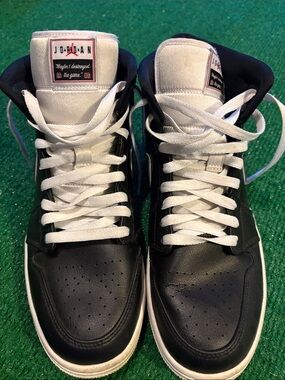Jordan Men’s Black and White High-Top Sneakers with Red Logo Accents